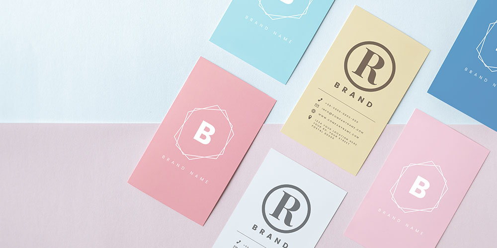 Colorful minimalist business cards with brand initials and contact info