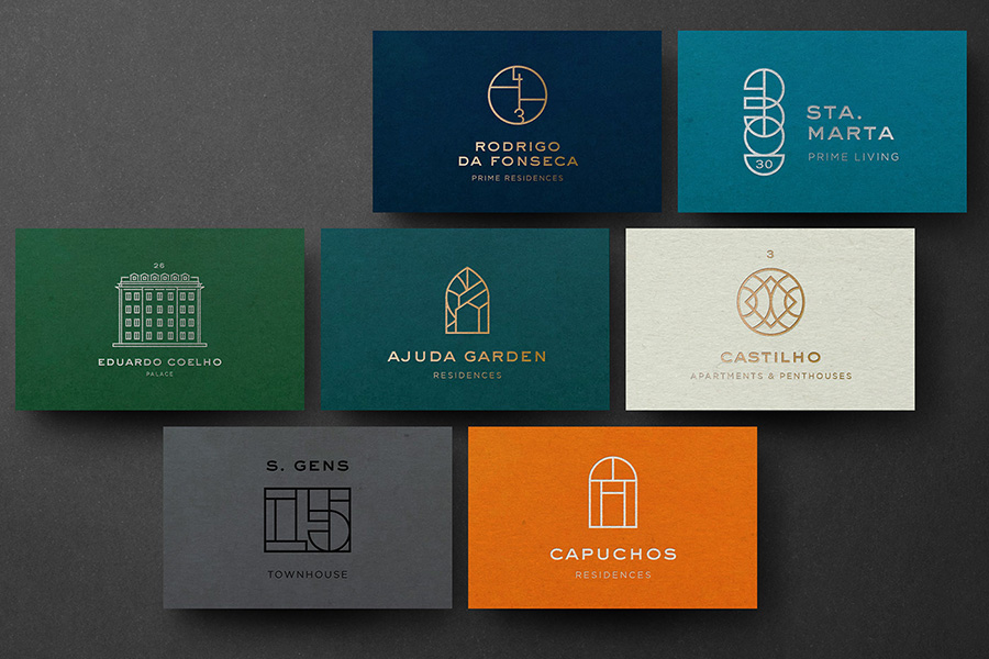 Collection of business cards for various investment properties under one brand