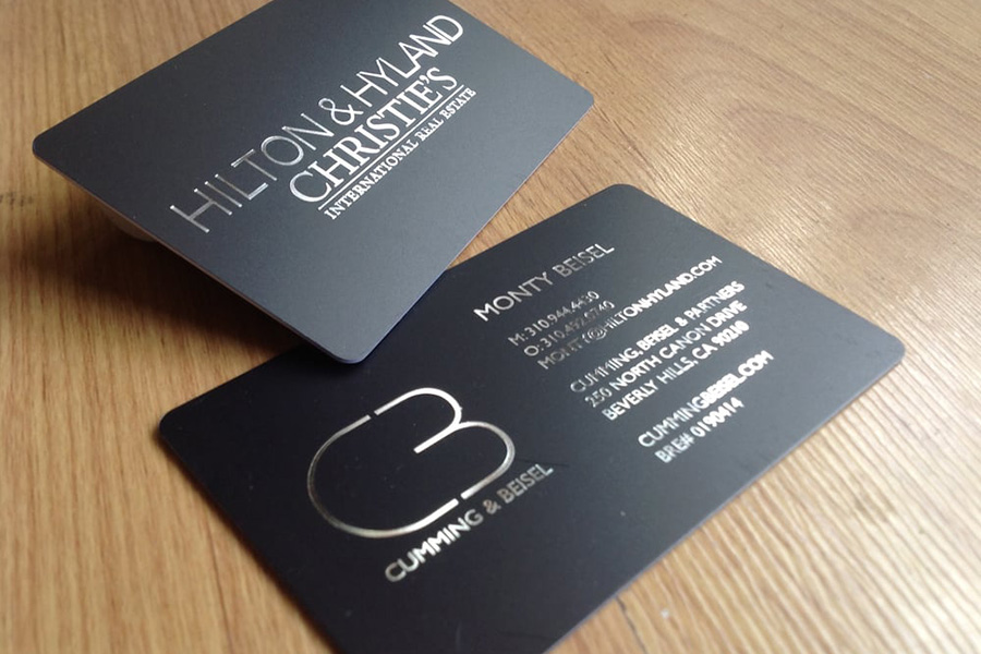 Satin black luxury business card with silver foil and rounded corners