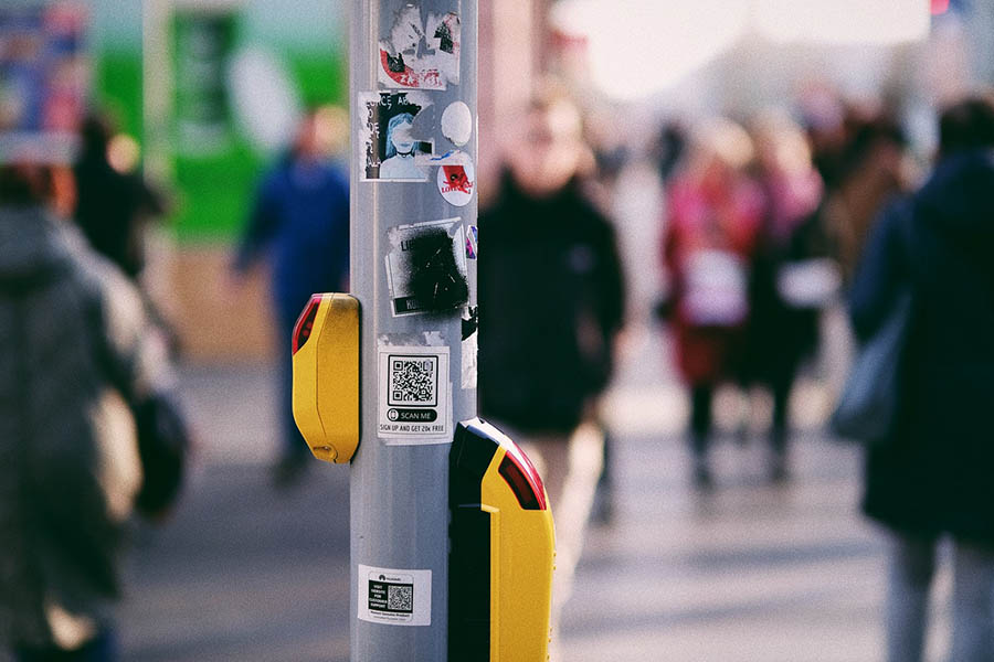 QR code stickers on light post in street