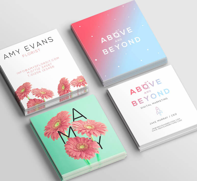 three business cards with pink flowers on them.