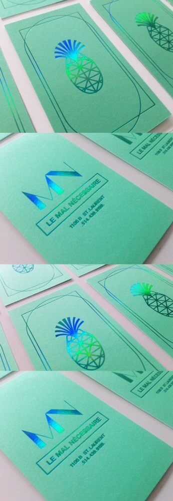 a close up of a bunch of green business cards.
