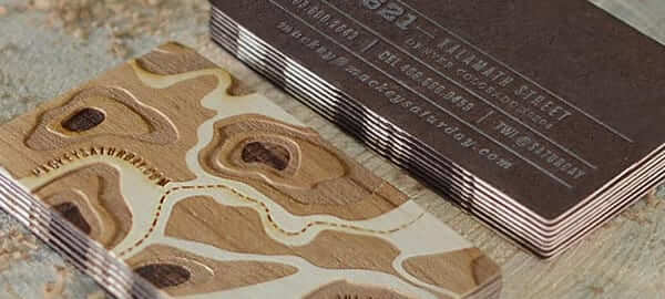 a close up of a business card on a table.