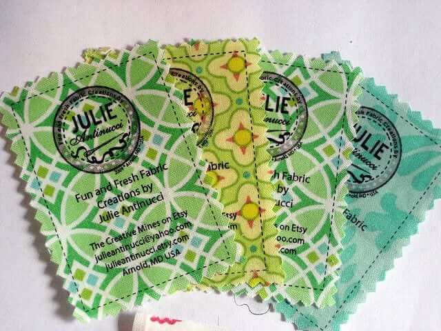 a group of four green and white tickets.
