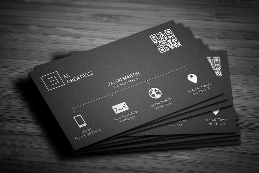 Dark business card on dark wood background